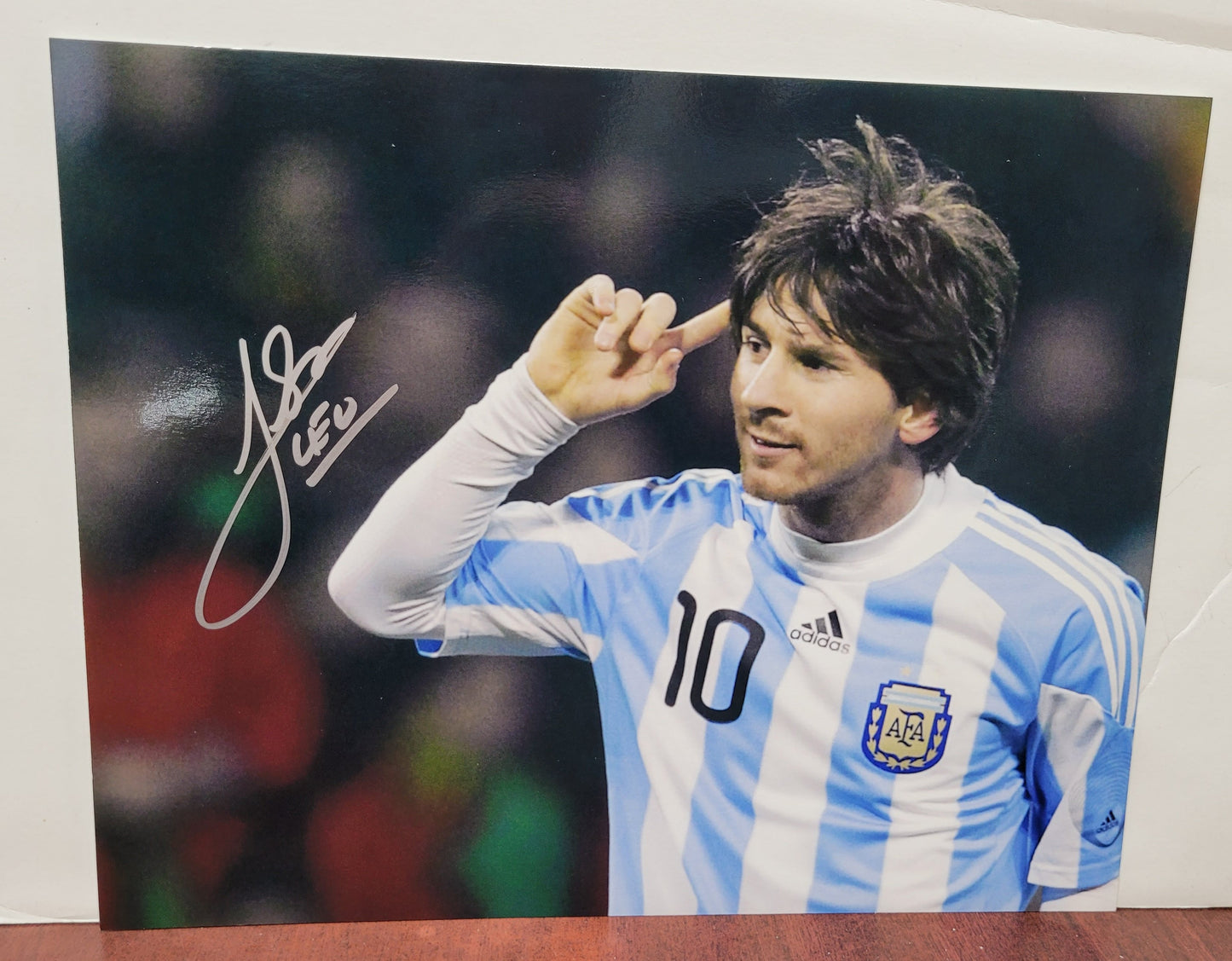 Lionel Messi Signed Photograph in Blue and White 10 Jersey