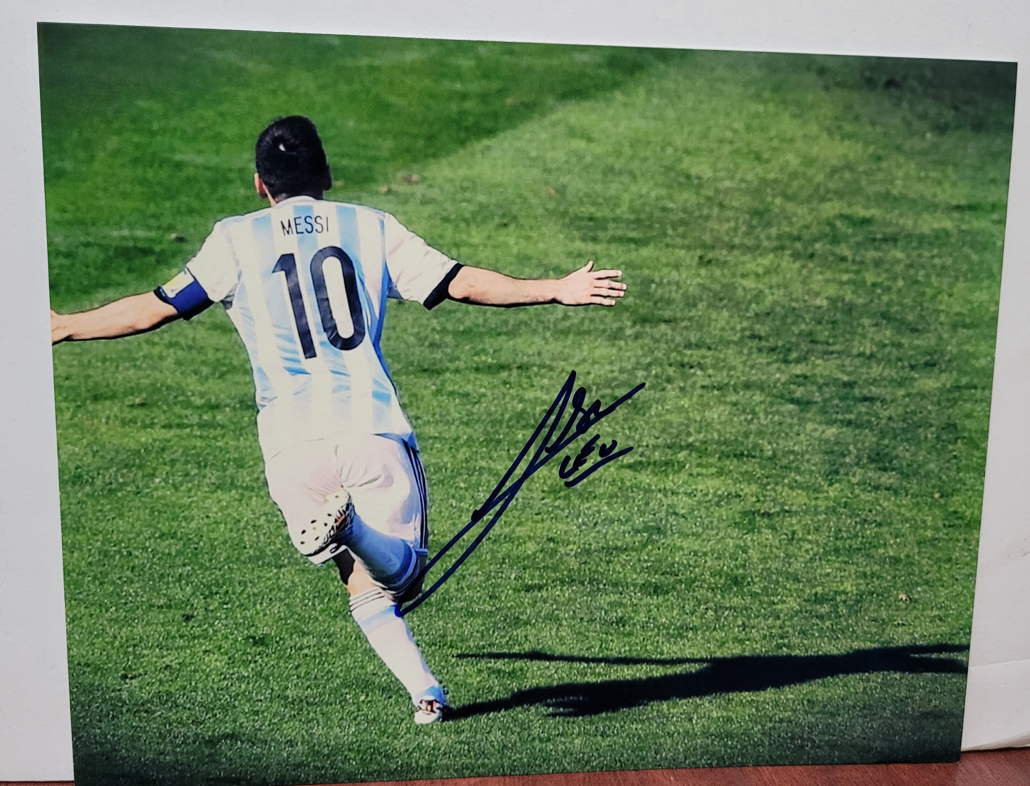 Lionel Messi Signed Photograph in Blue and White 10 Jersey