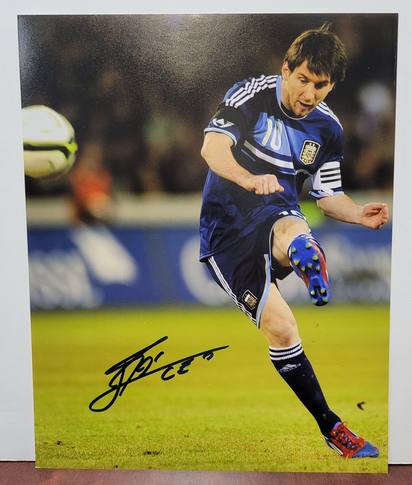 Lionel Messi Signed Photo in Blue and Black 10 Jersey
