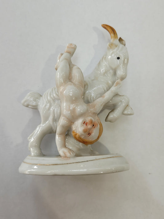 Goat Throwing Child Statue